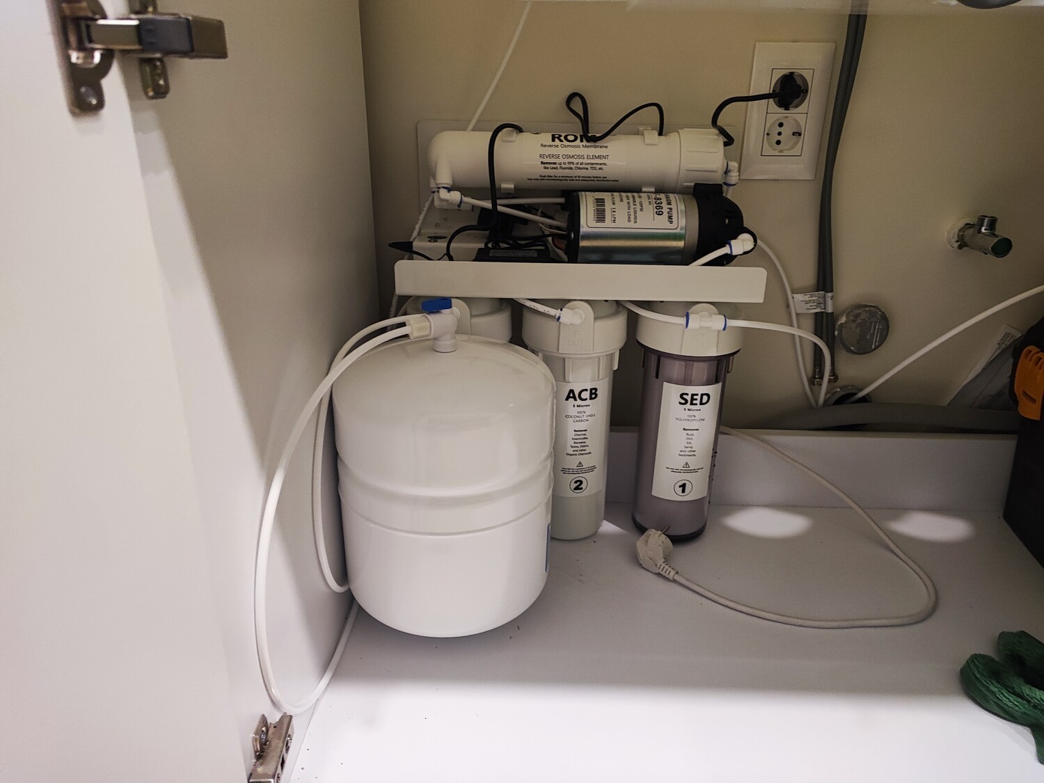 Reverse osmosis with a pressure-boosting pump.